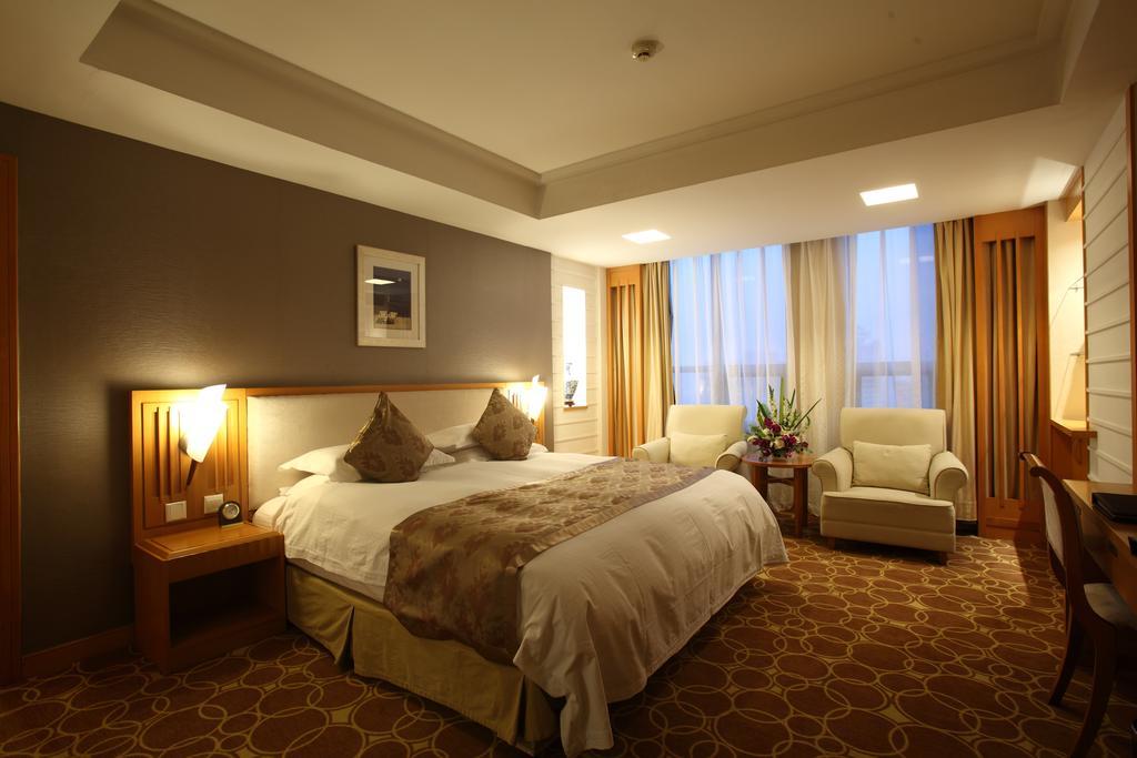 Beijing Wuhuan Hotel Habitación foto