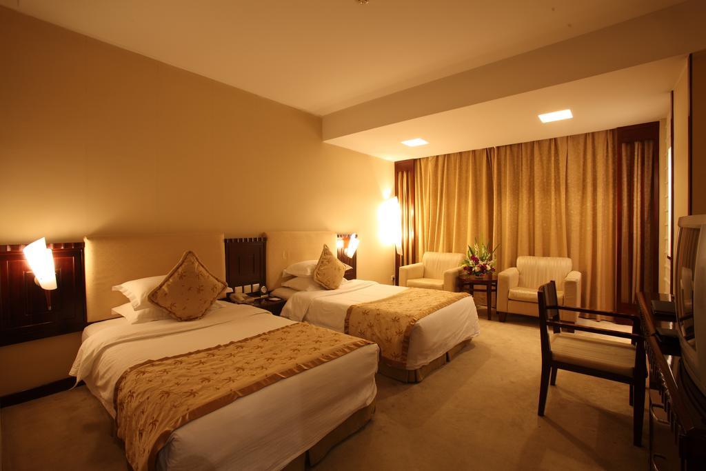 Beijing Wuhuan Hotel Habitación foto