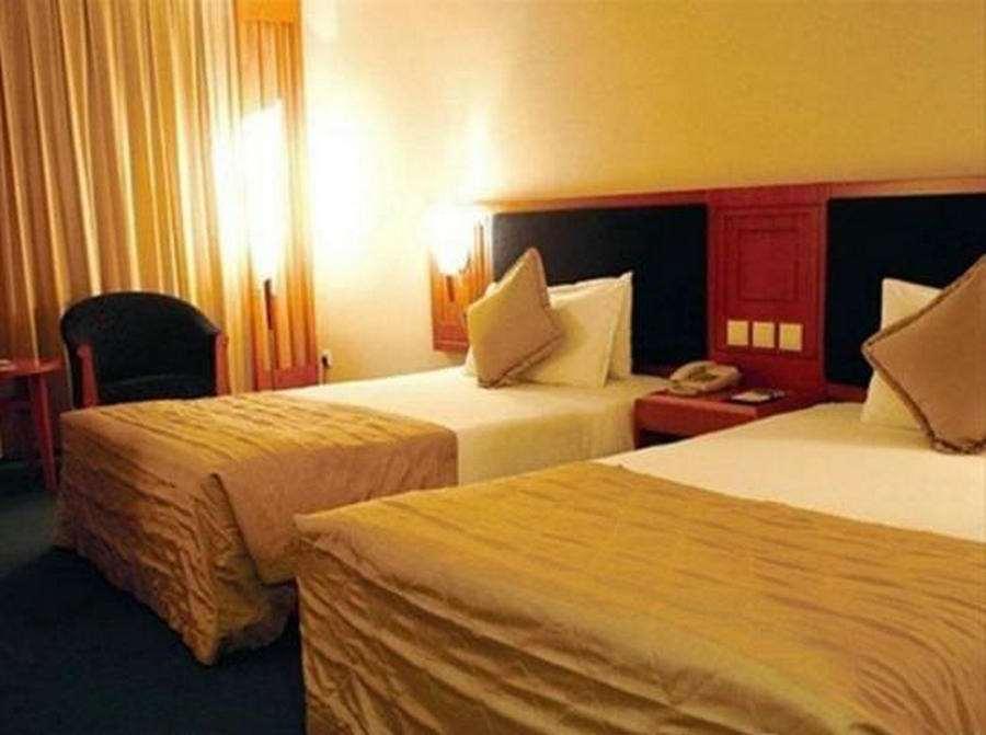 Beijing Wuhuan Hotel Habitación foto